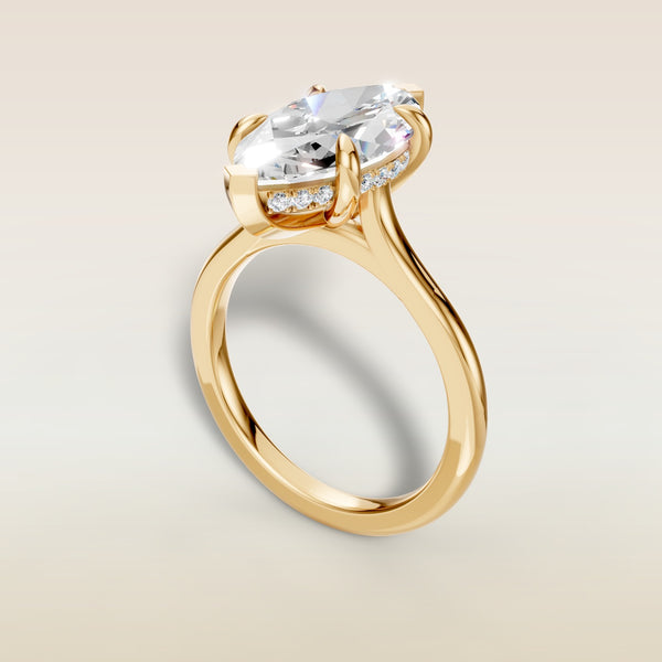 Marquise Hidden Halo Cathedral engagement ring in yellow gold, angled view