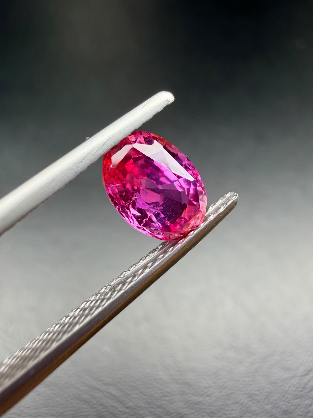 1.73ct Oval Orangy Pink Sapphire