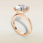 Round Classic Solitaire engagement ring in rose gold, angled view