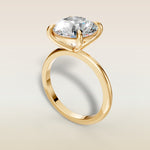 Round Classic Solitaire engagement ring in yellow gold, angled view