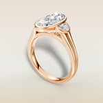 Moval Three Stone Full Bezel engagement ring in rose gold, angled view
