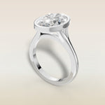 Oval Full Bezel Split Shank engagement ring in white gold, angled view
