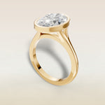 Oval Full Bezel Split Shank engagement ring in yellow gold