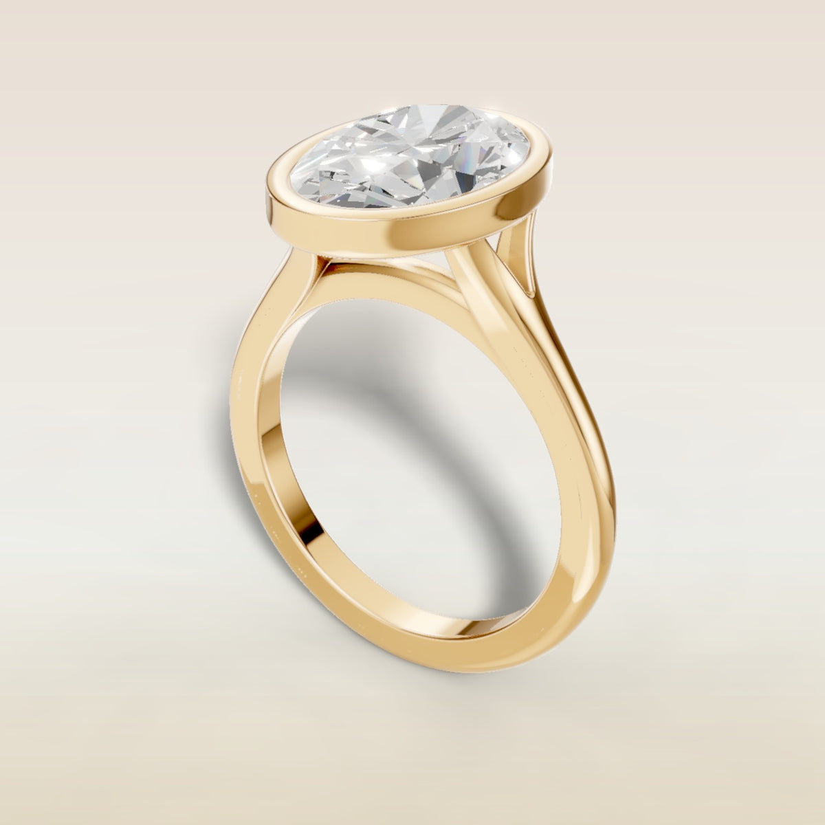 Oval Full Bezel Split Shank engagement ring in yellow gold