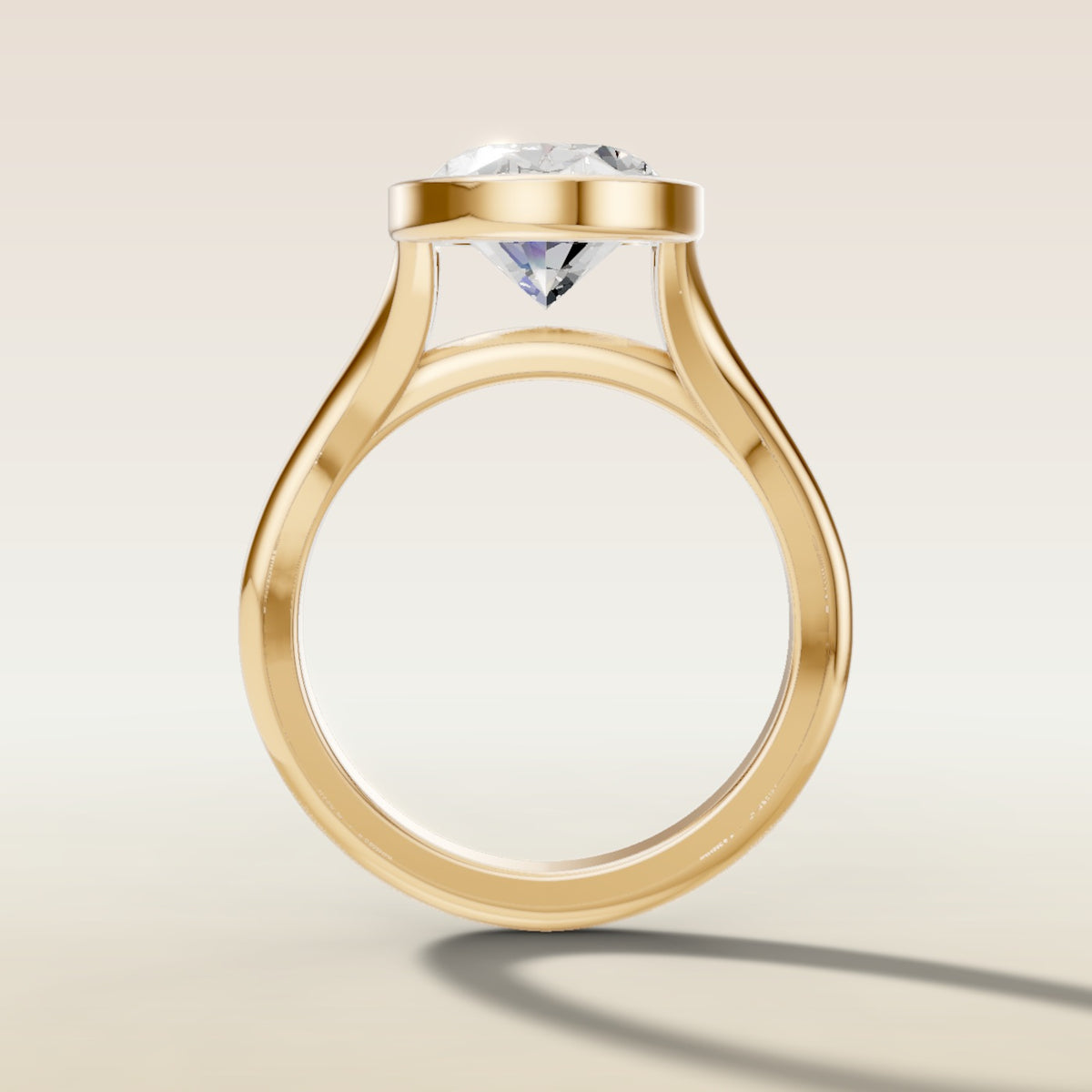 Oval Full Bezel Split Shank engagement ring in yellow gold