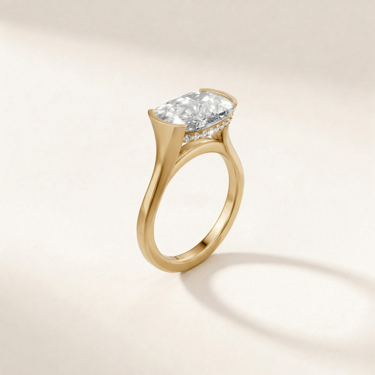 Half Bezel with Hidden Halo engagement ring with a cushion diamond in yellow gold