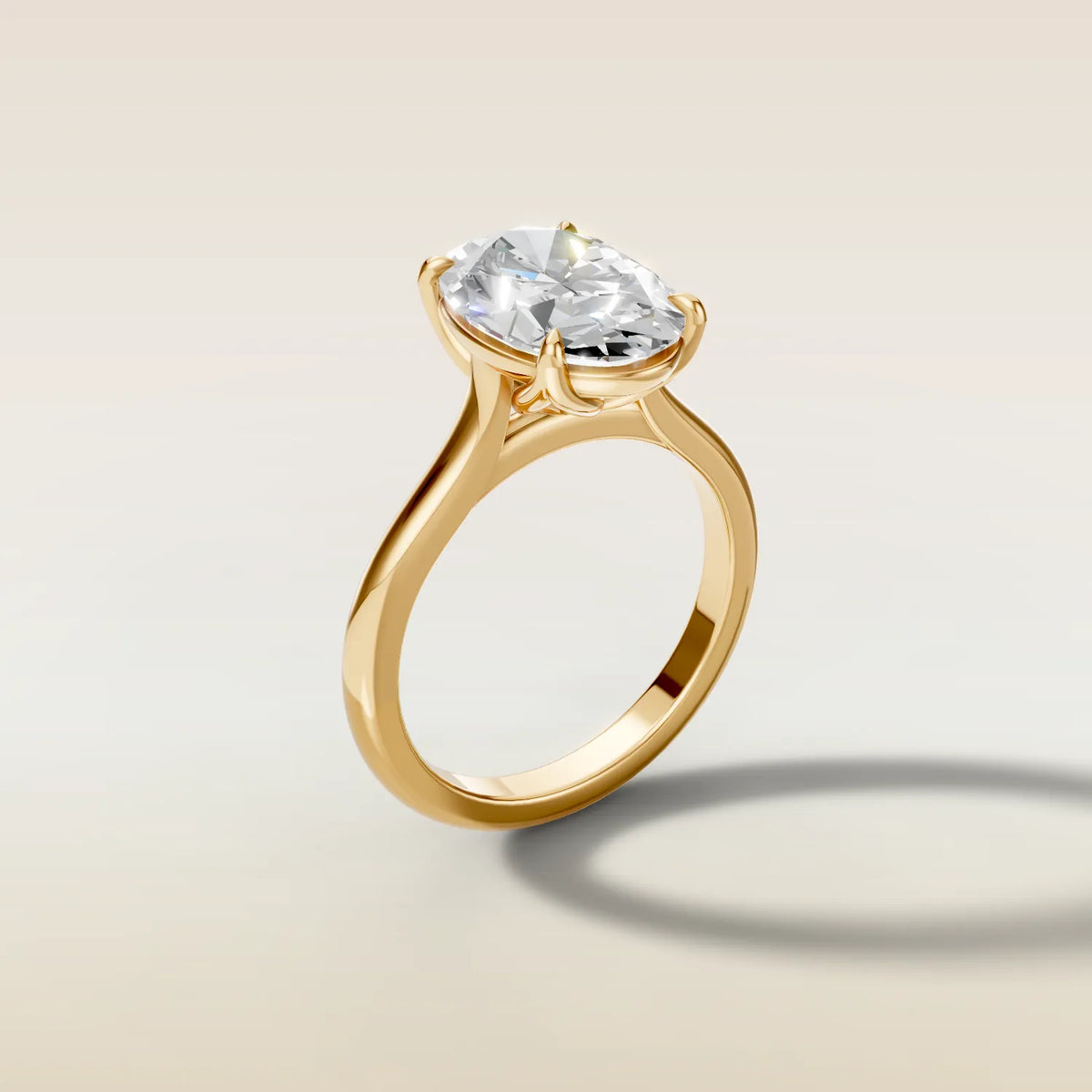 Tulip Classic engagement ring with an oval diamond in yellow gold, angled side view