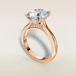Cushion Curved Hidden Halo Diamond Bridge engagement ring in rose gold, angled view