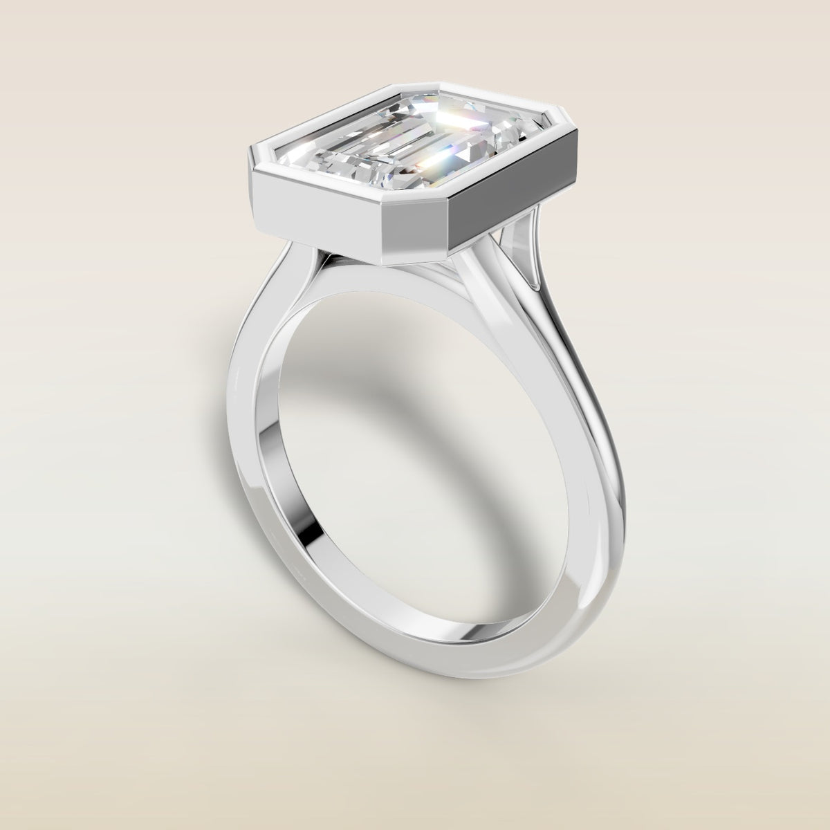Emerald Full Bezel Split Shank engagement ring in white gold, angled view