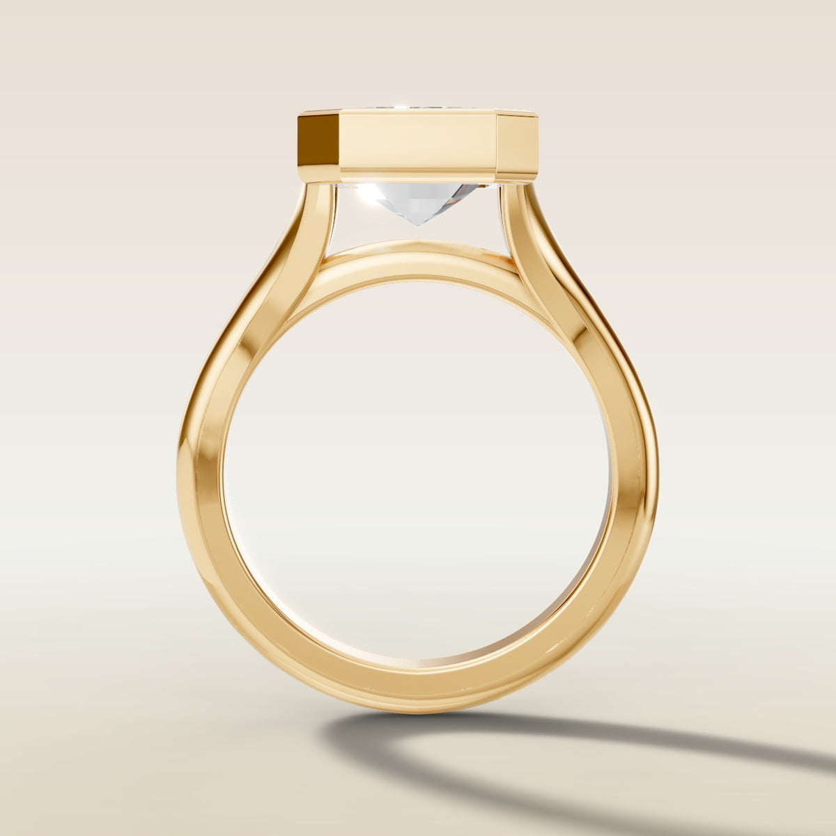Emerald Full Bezel Split Shank engagement ring in yellow gold, front view