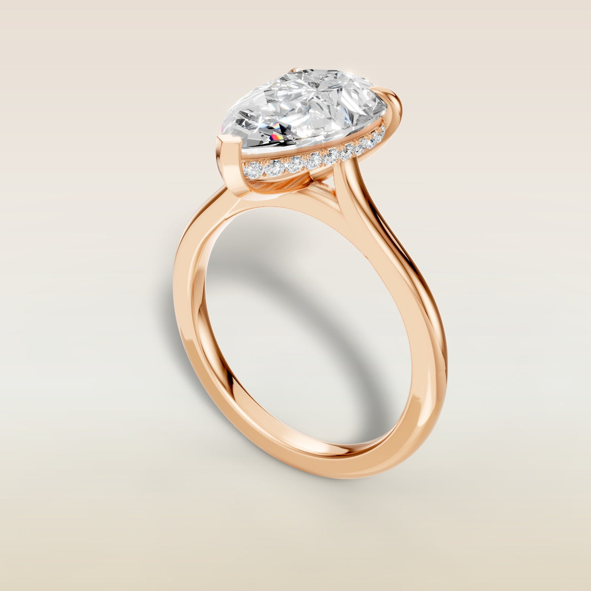 Pear Hidden Halo Cathedral engagement ring in rose gold, angled view