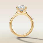 Pear Hidden Halo Cathedral engagement ring in yellow gold, front view