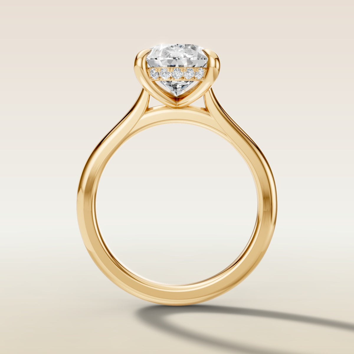 Pear Hidden Halo Cathedral engagement ring in yellow gold, front view