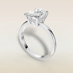 Cushion Low Profile Hidden Halo engagement ring in white gold, angled view