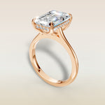 Emerald Tulip with Hidden Halo engagement ring in rose gold, angled view