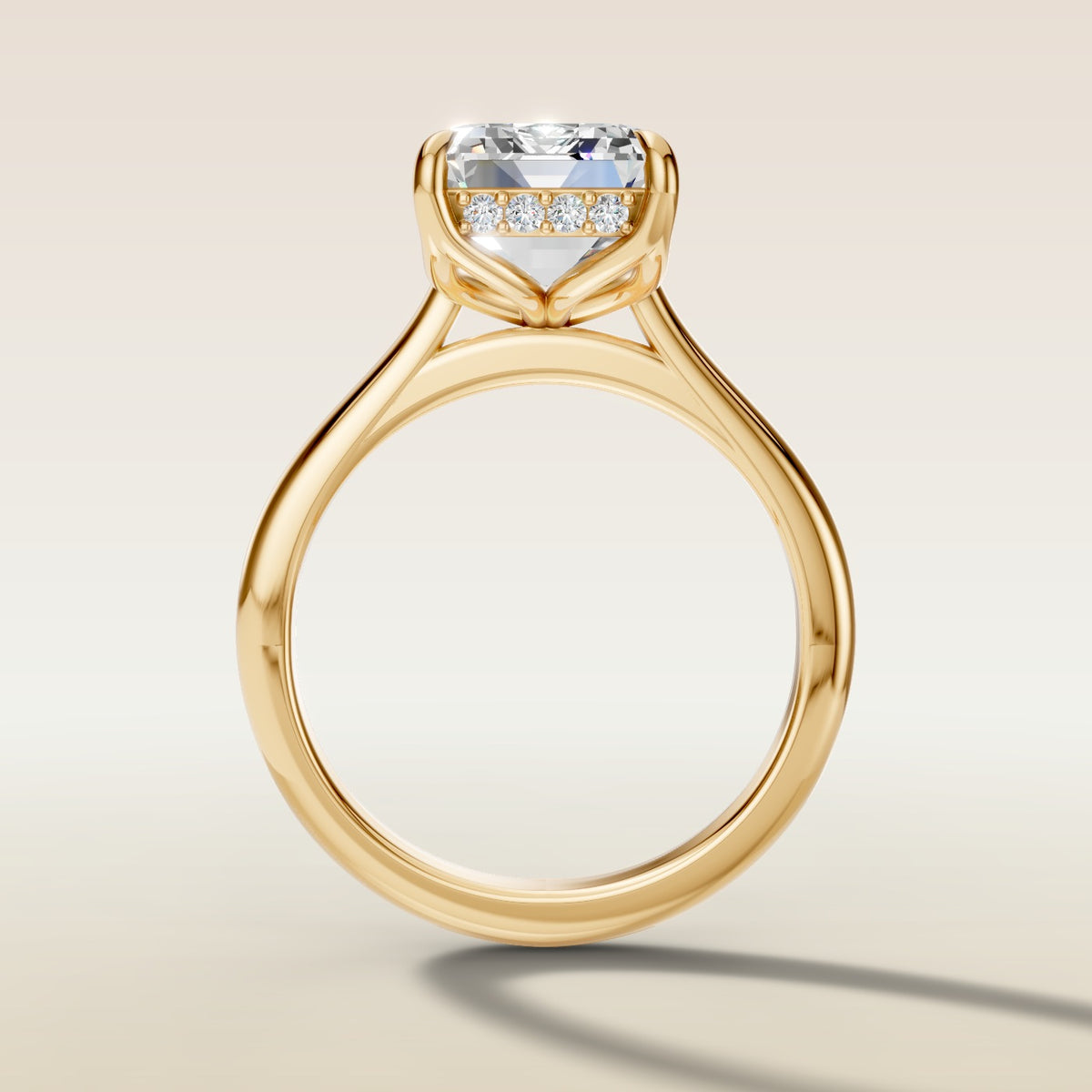 Emerald Tulip with Hidden Halo engagement ring in yellow gold, front view