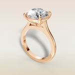 Round Classic Cathedral engagement ring in rose gold, angled view