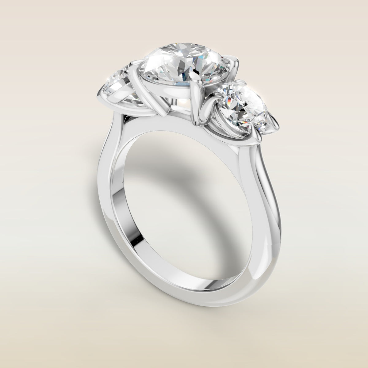 Round Three Stone engagement ring in white gold, angled view