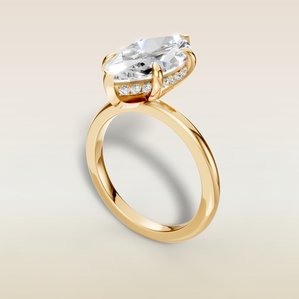 Marquise Hidden Halo Solitaire engagement ring in yellow gold, angled view
