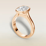 Cushion Full Bezel Cathedral engagement ring in rose gold, angled view