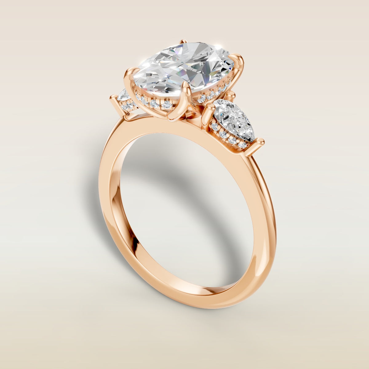 Oval Tulip Three Stone Hidden Halo engagement ring in rose gold, angled view