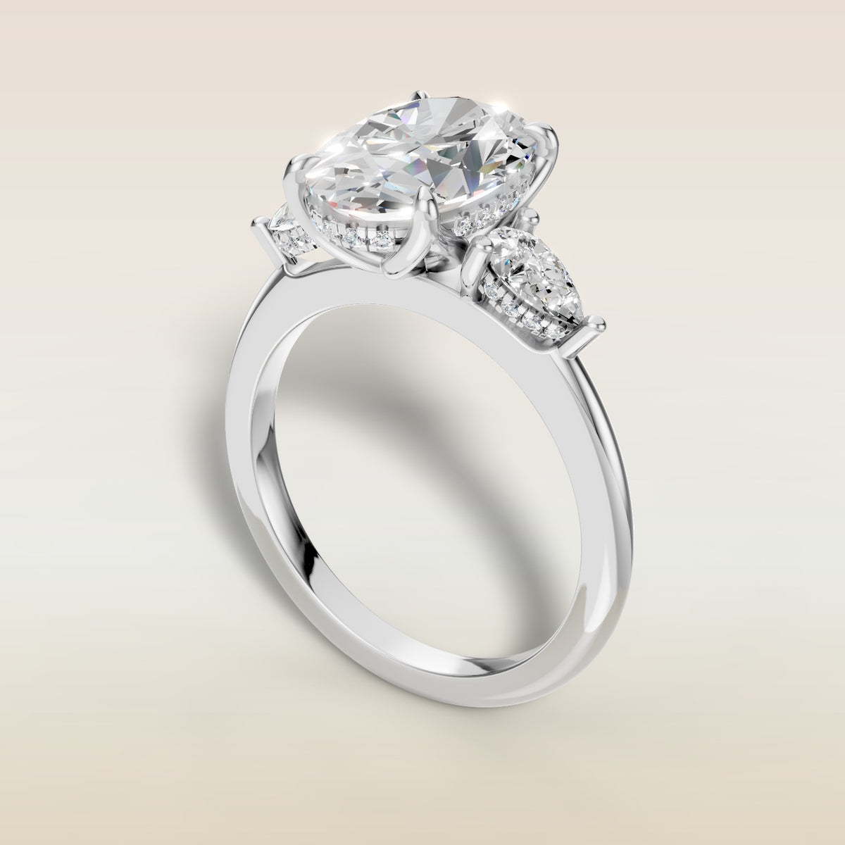 Oval Tulip Three Stone Hidden Halo engagement ring in white gold, angled view