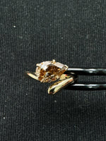 Pear champagne diamond ring detail view worn on hand