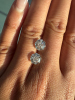 Pair of 2ct rose octagonal lab diamonds on the hand