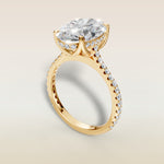 Oval Tulip Hidden Halo Pave engagement ring in yellow gold, angled view