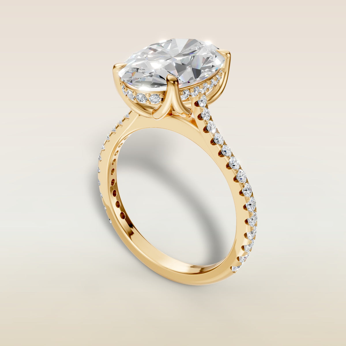 Oval Tulip Hidden Halo Pave engagement ring in yellow gold, angled view