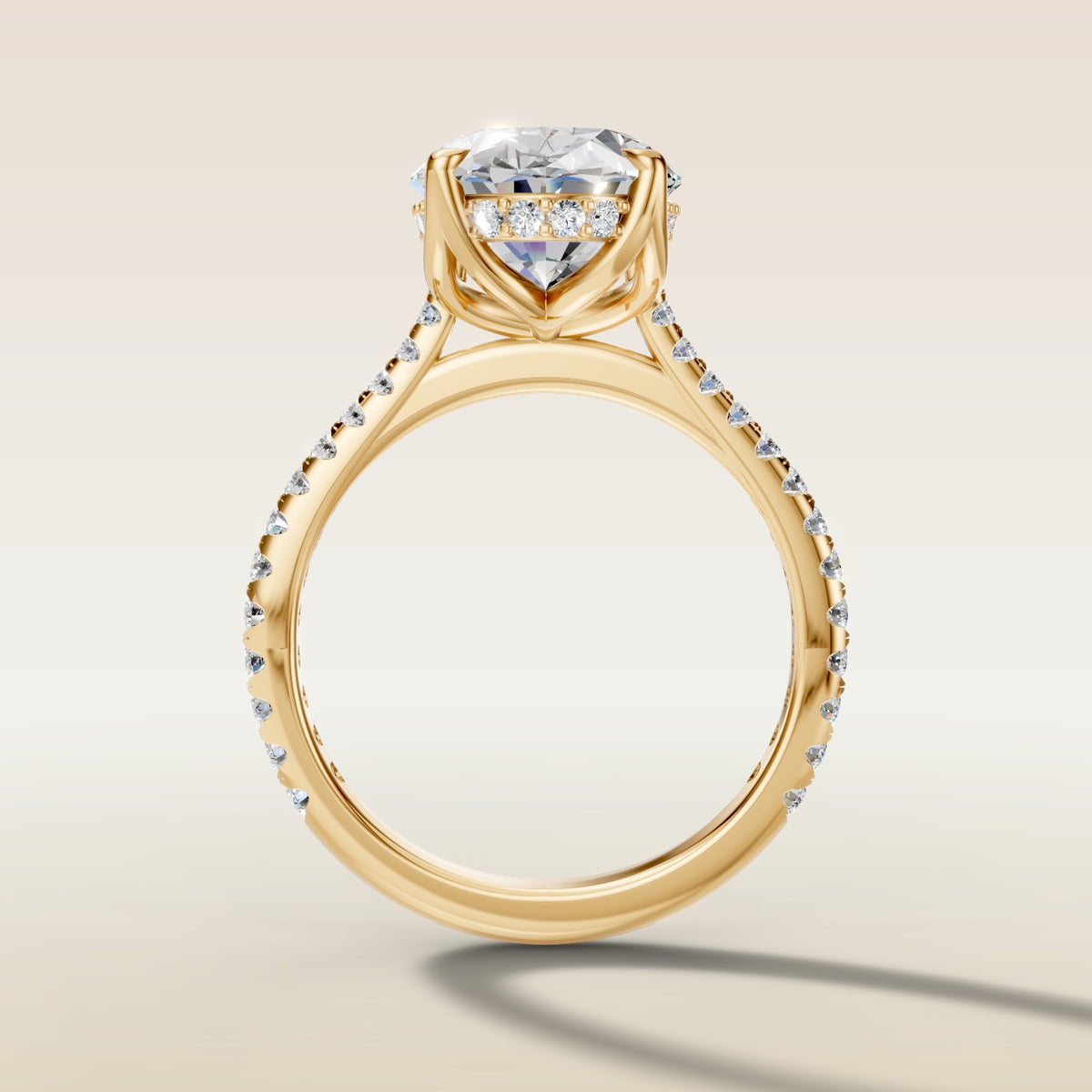 Oval Tulip Hidden Halo Pave engagement ring in yellow gold, front view