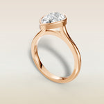 Pear Full Bezel Cathedral engagement ring in rose gold, angled view