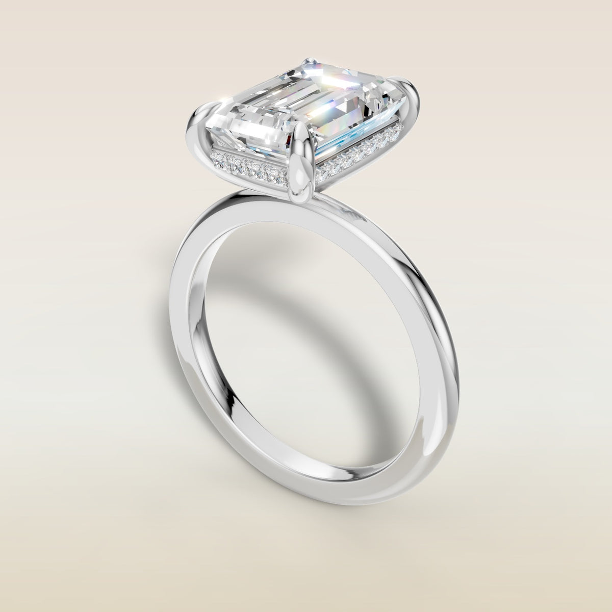 Emerald Hidden Halo Solitaire engagement ring in white gold, angled view