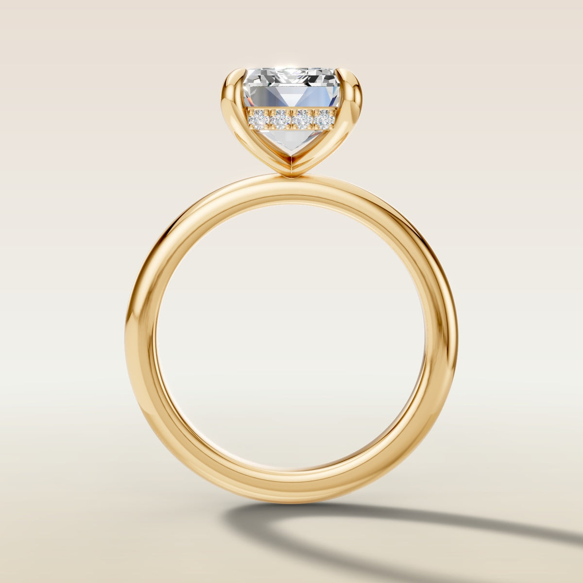 Emerald Hidden Halo Solitaire engagement ring in yellow gold, front view