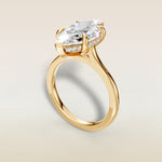 Marquise Hidden Halo Cathedral engagement ring in yellow gold, angled view