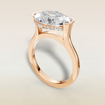 Oval Half Bezel with Hidden Halo engagement ring in rose gold, angled view