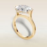 Oval Half Bezel with Hidden Halo engagement ring in yellow gold