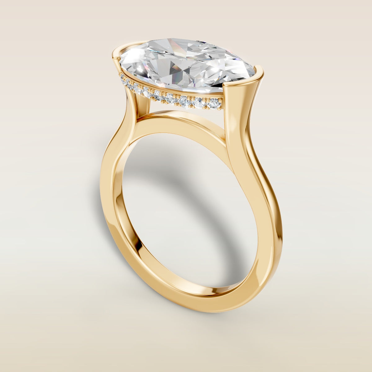 Oval Half Bezel with Hidden Halo engagement ring in yellow gold, angled view