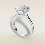 Oval Four Petal Tulip Curved Hidden Halo engagement ring in white gold, angled view