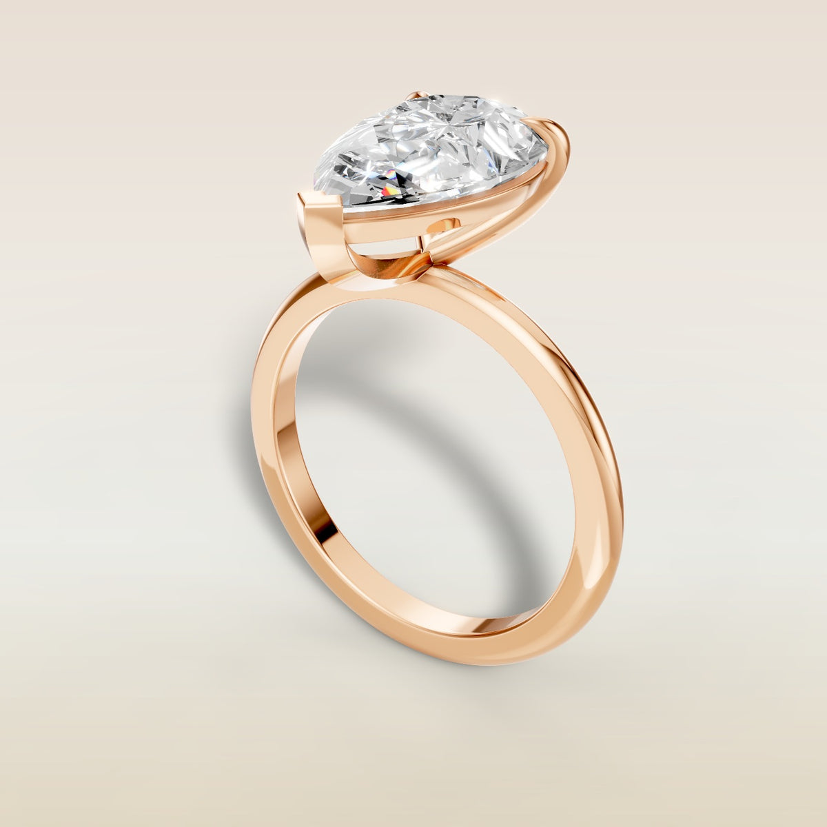 Pear Classic Solitaire engagement ring in rose gold, angled view