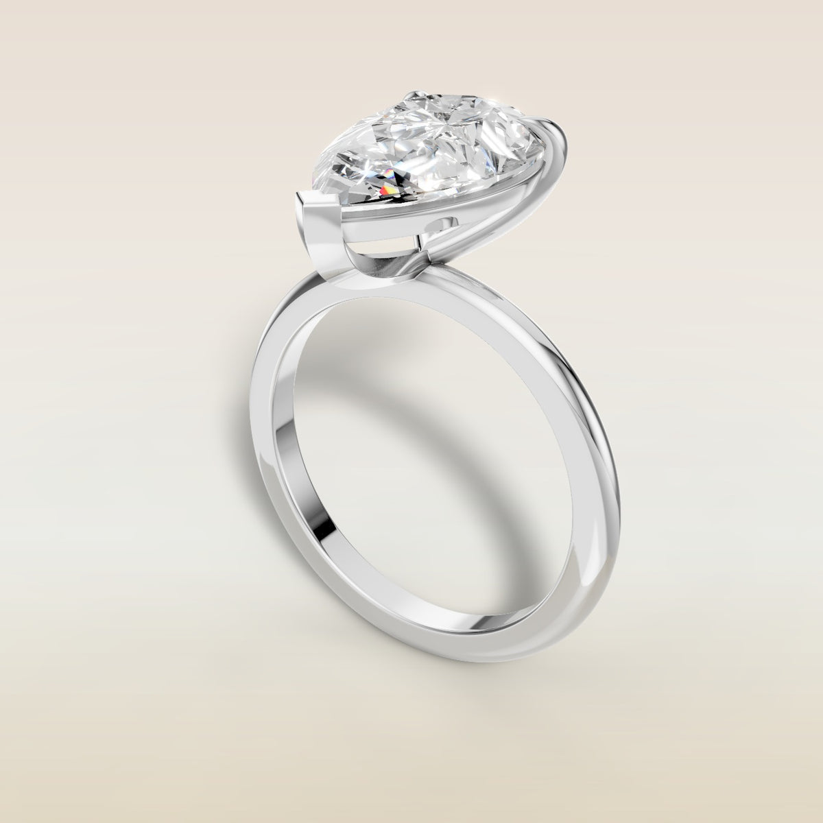 Pear Classic Solitaire engagement ring in white gold, angled view