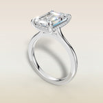 Emerald Hidden Halo Cathedral engagement ring in white gold, angled view
