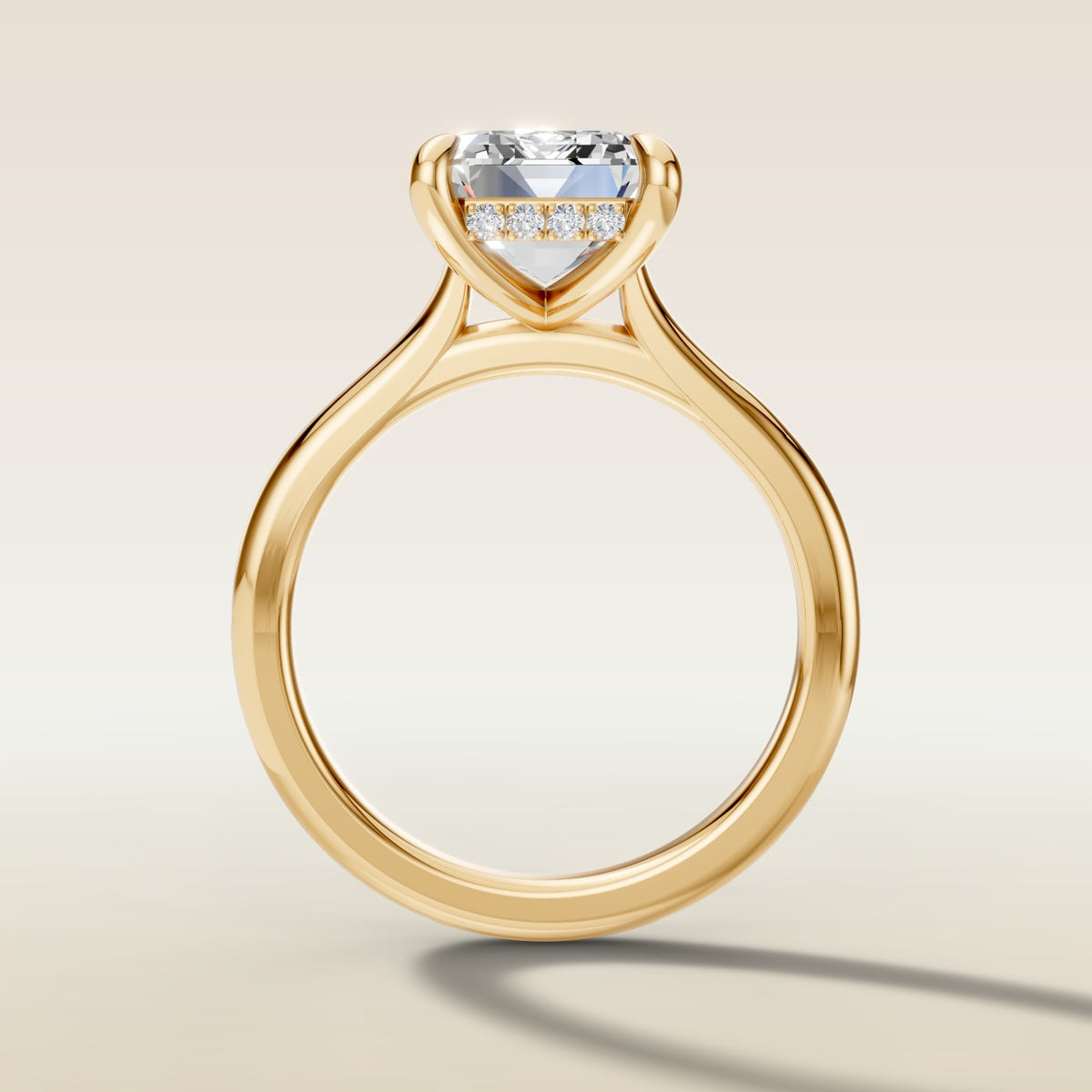 Emerald Hidden Halo Cathedral engagement ring in yellow gold, front view
