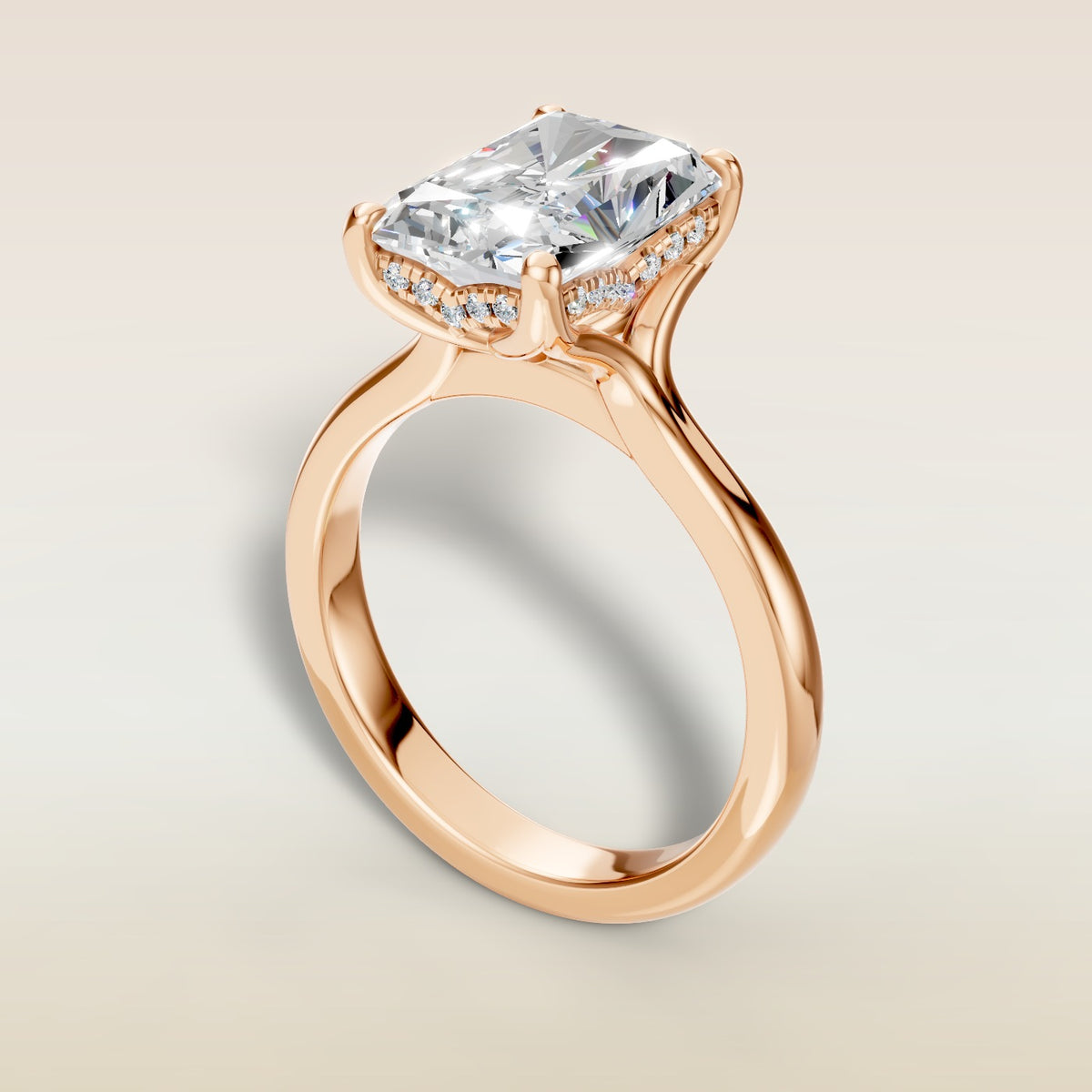 Radiant Tulip Curved Hidden Halo Split Shank engagement ring in rose gold, angled view