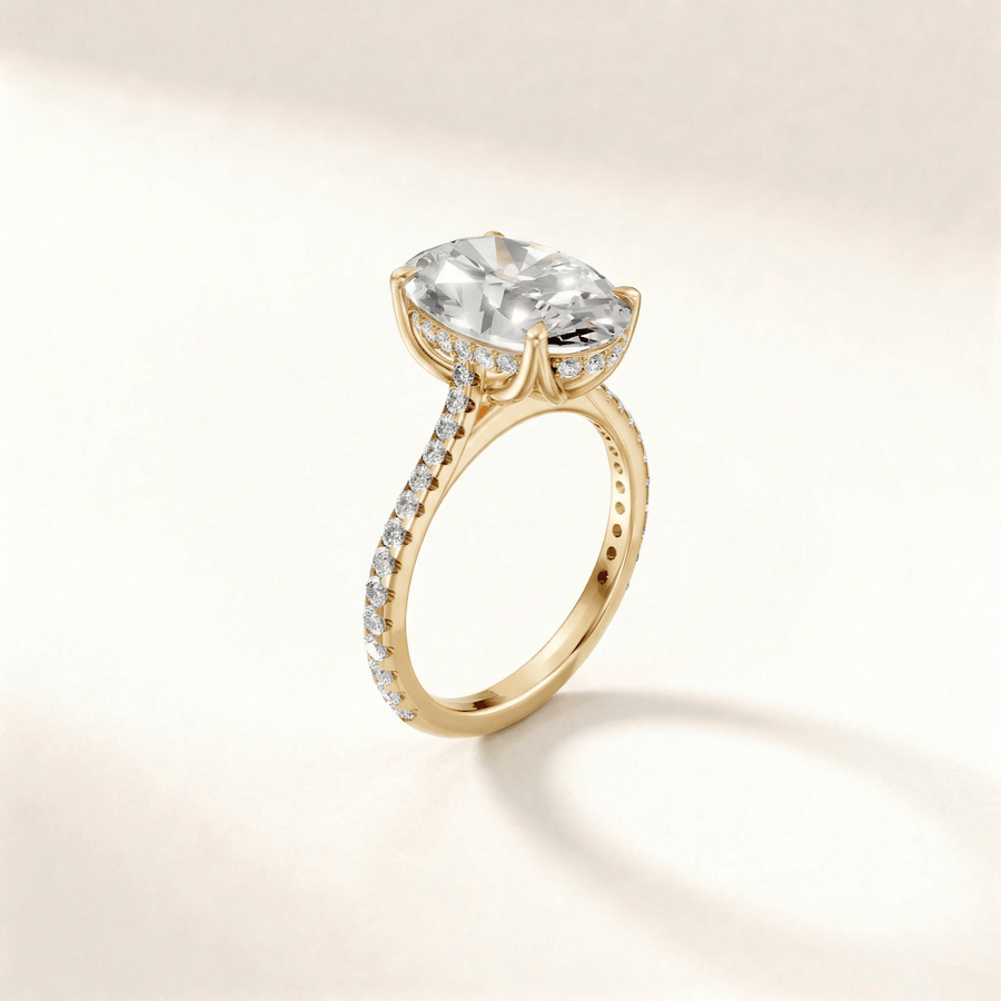 Tulip hidden halo pavé engagement ring in yellow gold, angle view