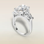 Oval Four Petal Tulip Three Stone engagement ring in white gold, angled view