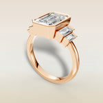 Emerald Five Stone Full Bezel engagement ring in rose gold, angled view