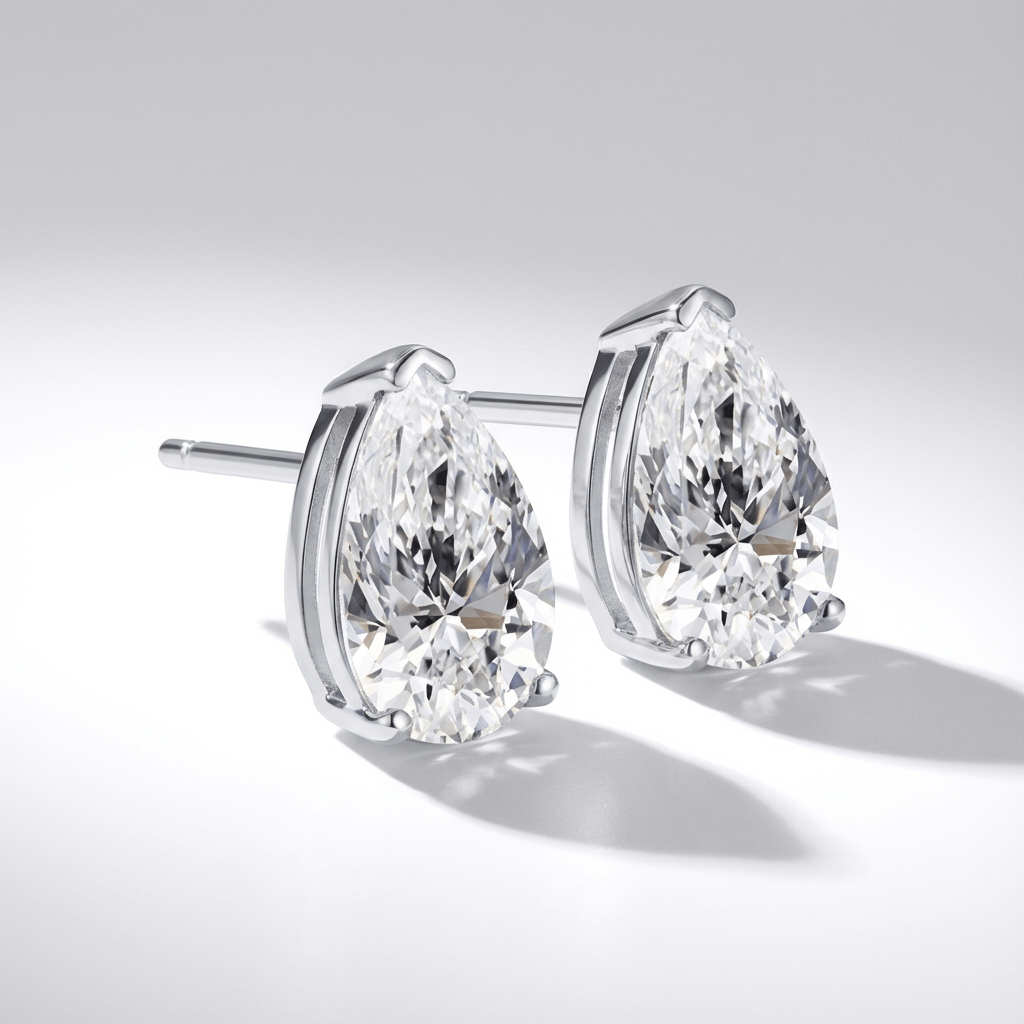 Lab grown diamond stud earrings with pear shaped diamonds in white gold