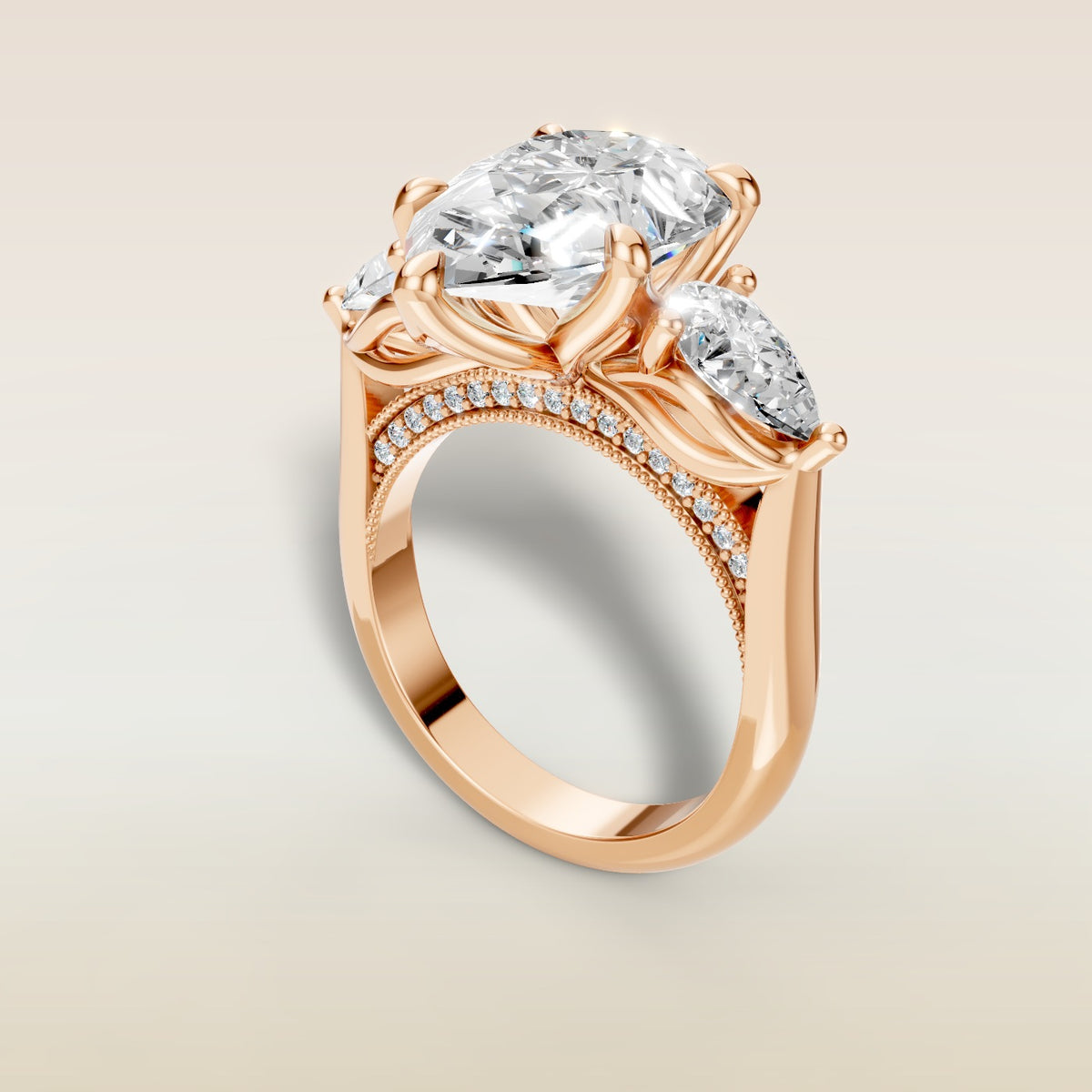 Pear Tulip Three Stone Diamond Bridge engagement ring in rose gold, angled view