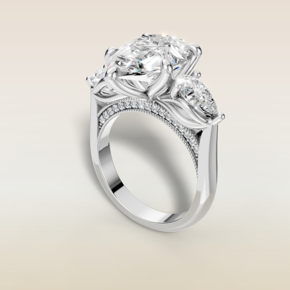 Pear Tulip Three Stone Diamond Bridge engagement ring in white gold, angled view